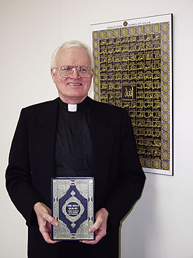 Scarboro missioner Fr. David Warren holds the Qur'an