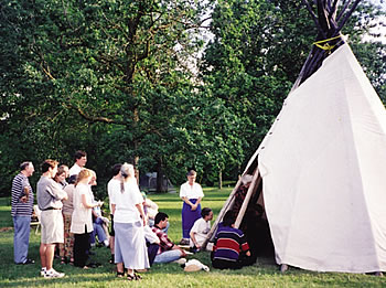 The closing ritual at the NAIN conference takes place in and around the tepee where the sacred fire burns.