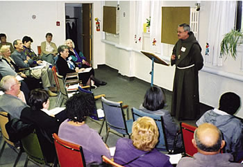 Franciscan Father Damian MacPherson speaks at an interfaith event at Scarboro Missions focusing on religious freedom.